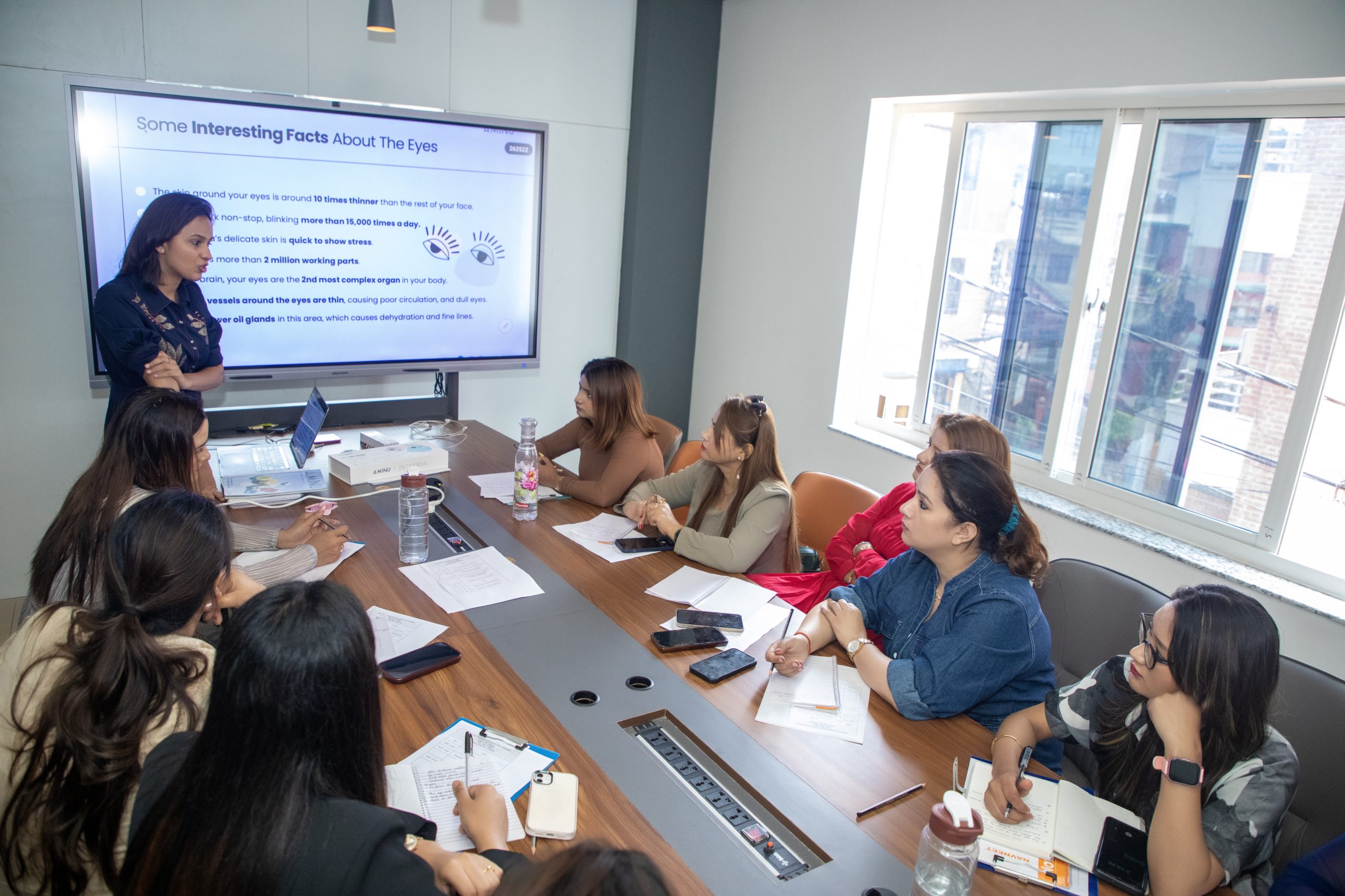 Presenter Leading Skin Care Certification Workshop on Eye Care Facts in Meeting Room