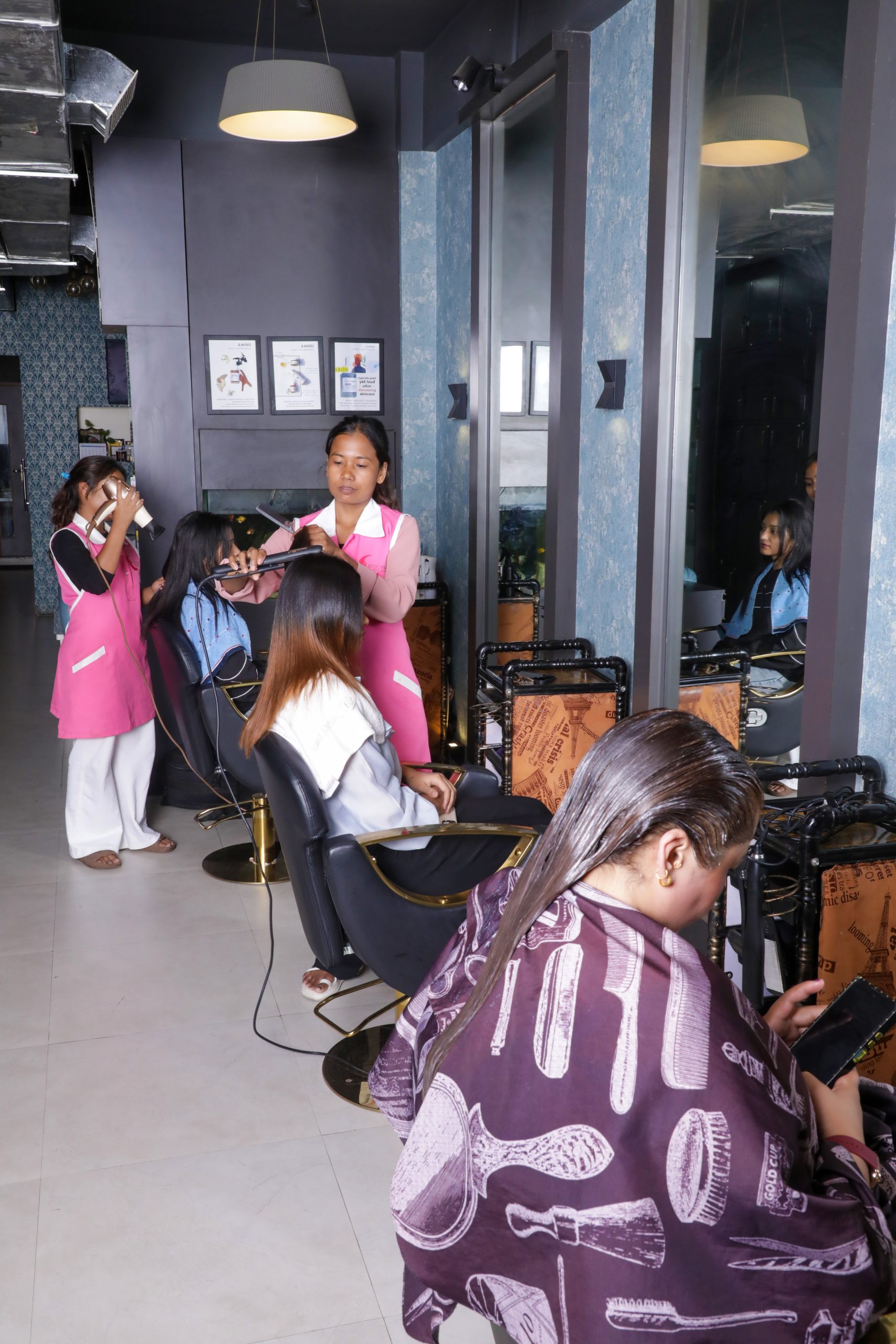 Students Practicing Hair Styling in a Barber Certification Course at a Modern Salon